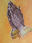 les mains en prière
